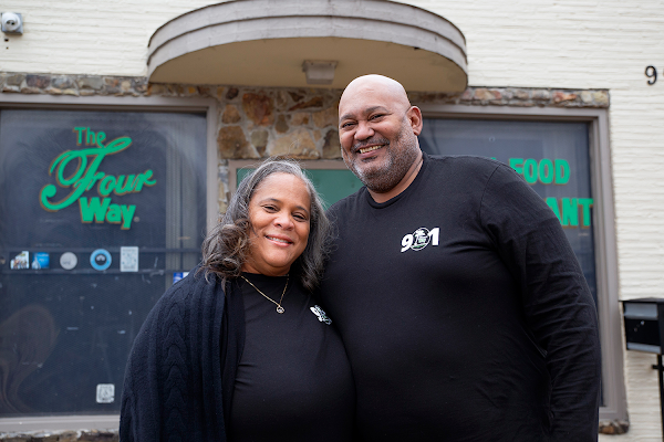 Patrice Bates Thompson, owner of The Four Way Restaurant, and her husband, Jerry Thompson, pose in front of the restaurant.