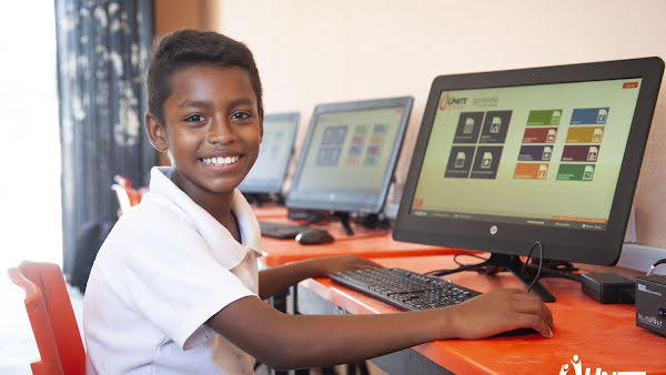Photo of a boy in front of a computer