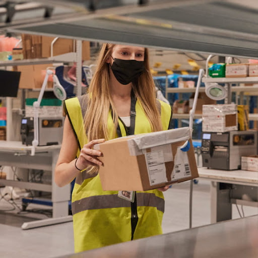 A female worker holding a package 
