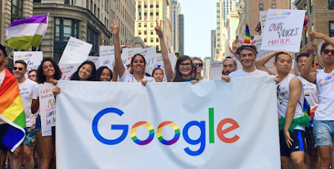 A group of employees from Google’s LGBTQ+ employee resource group, march together in a pride parade