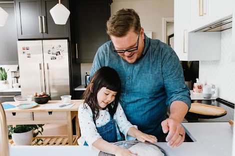 A father and daughter knead pizza dough as a way to help find a balance with technology.