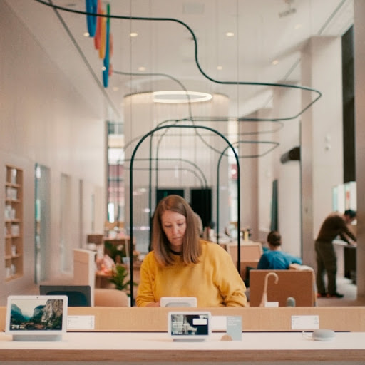 A girl exploring products at the Google store