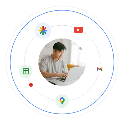 Un uomo giovane che utilizza un laptop, circondato dai loghi dei prodotti Google.
