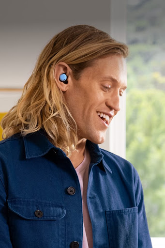 A person taking a phone call using Pixel Buds Pro and Pixel phone in Bay