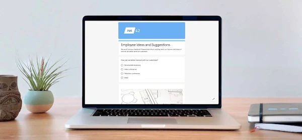 Laptop showing Google Forms UI. 