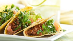 Three beef tacos on a plate.