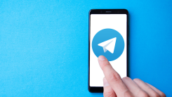 Telegram logo displayed on a phone