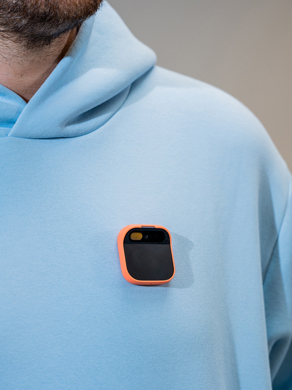 Photo of An Ai Pin being worn by George Kedenburg III a company employee at the headquarters of Humane in San Francisco