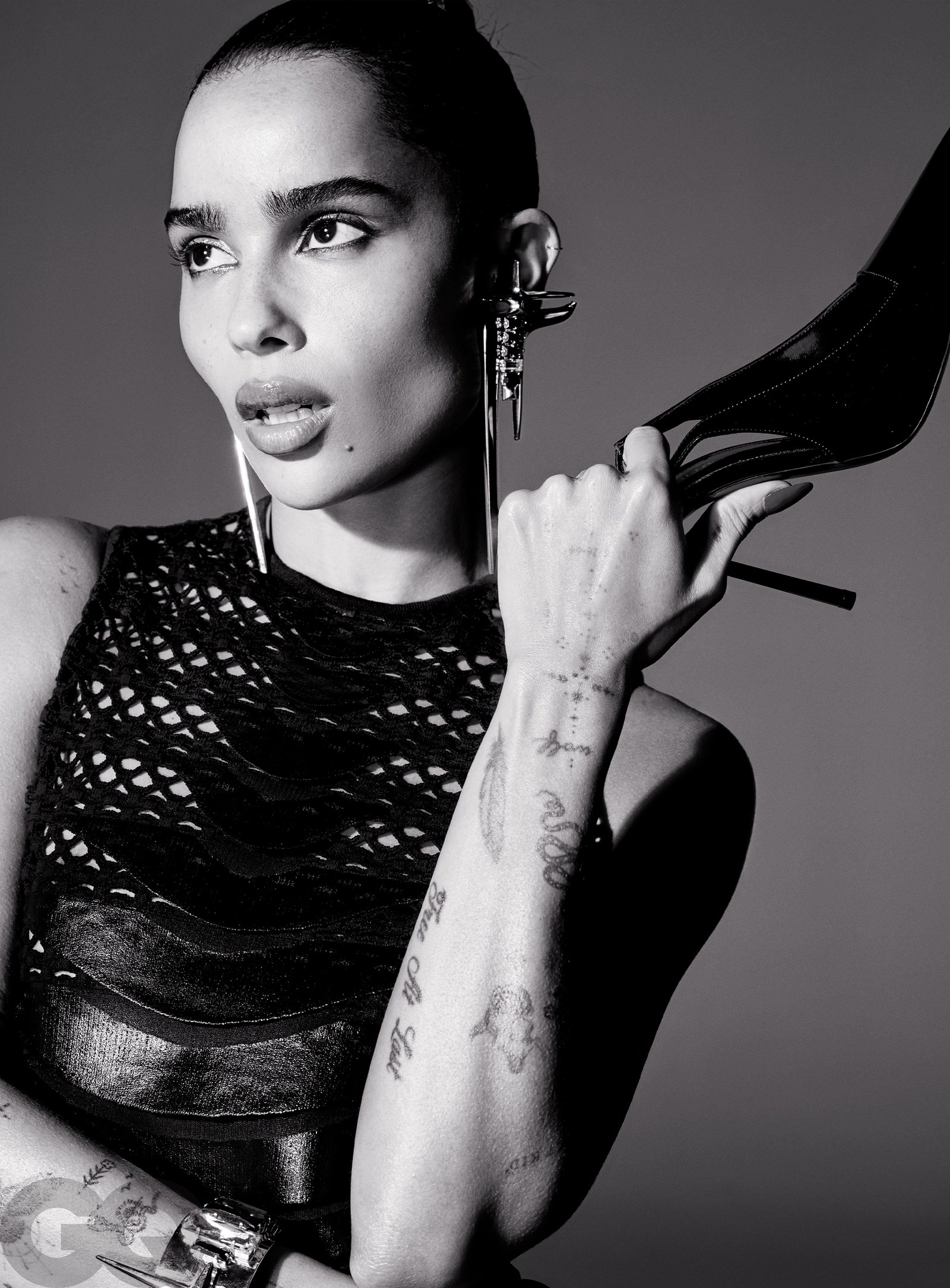 Image may contain Tattoo Skin Person Zoë Kravitz Adult Footwear High Heel Clothing Shoe Portrait and Head