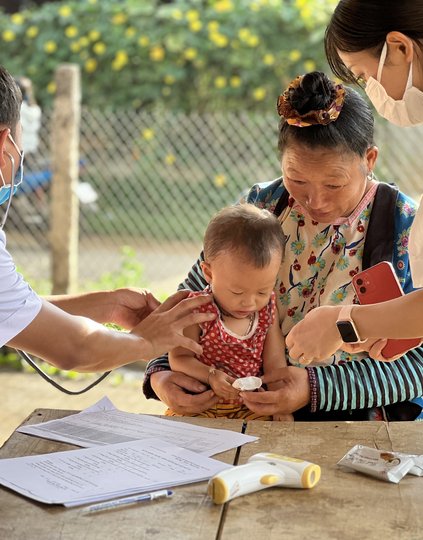 Health care workers conduct a supportive supervision session at a vaccination point in Tuan Giao district, Dien Bien province, Vietnam.