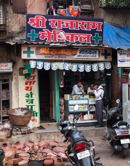The front of a pharmacy on a busy street in Mumbai.