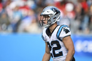 Christian McCaffrey #22 of the Carolina Panthers stands on the field during the second quarter against the San Francisco 49ers at Bank of America Stadium on October 09, 2022 in Charlotte, North Carolina.
