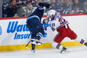 Libor Hajek battles Adam Lowry for the puck during the Rangers' 4-1 loss to the Jets.