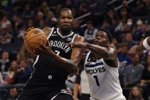 Kevin Durant drives to the basket during the Nets' preseason win over the Timberwolves.