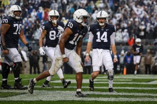 Nicholas Singleton #10 of the Penn State Nittany Lions celebrates with Sean Clifford #14 after scoring a touchdown