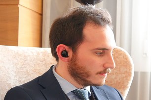 A man with earbuds in