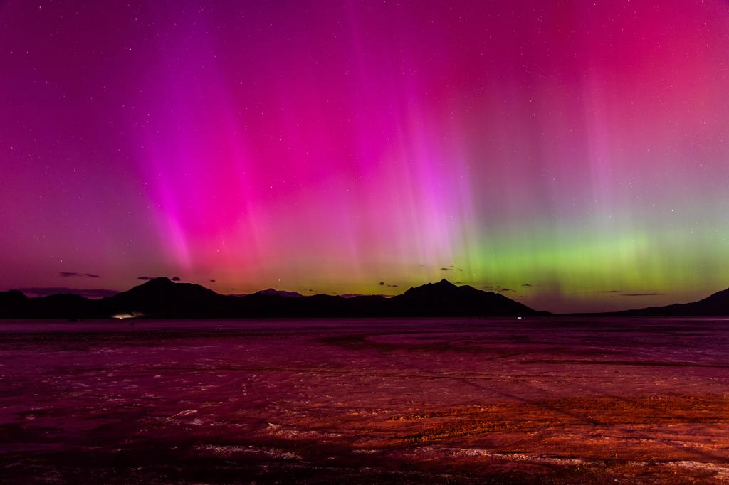 A geomagnetic storm lights up the night sky above the Bonneville Salt Flats on May 10, 2024 in Wendover, Utah.