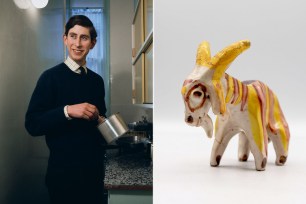 Charles, Prince of Wales, standing in a kitchen with a goat statue