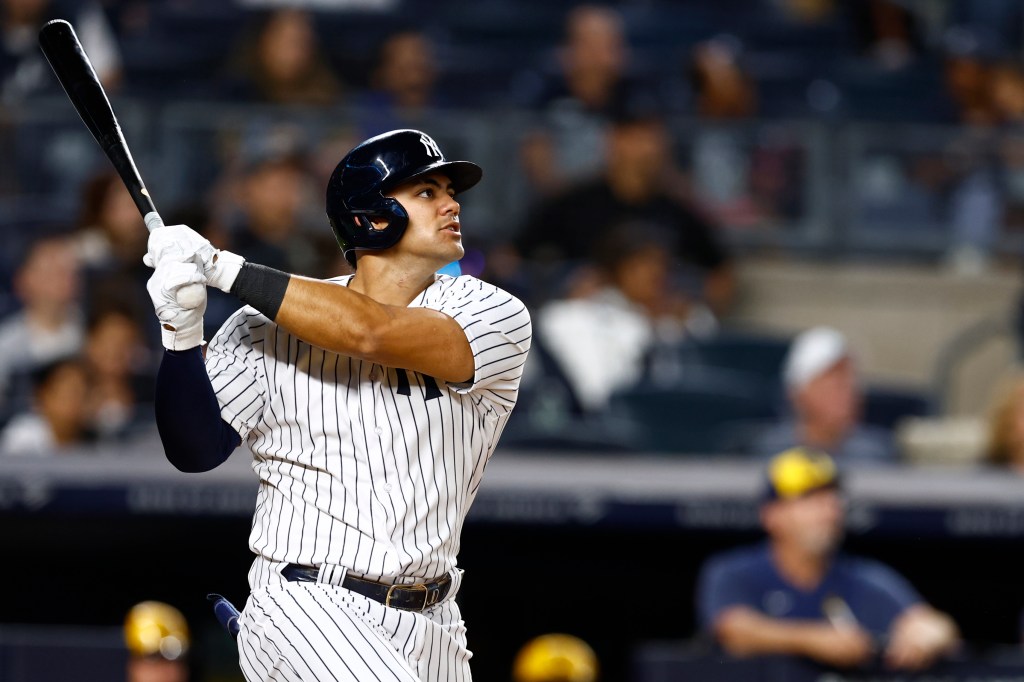 Jasson Dominguez #89 of the New York Yankees hits a two-run home run against the Milwaukee Brewers during the third inning of a game at Yankee Stadium on September 8, 2023 in New York City