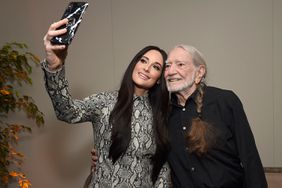 Kacey Musgraves (L) and Willie Nelson attend the Producers & Engineers Wing 12th annual GRAMMY week event honoring Willie Nelson at Village Studios on February 6, 2019 in Los Angeles, California.