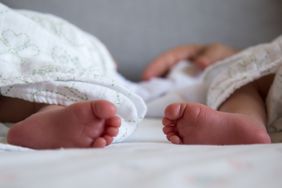 Stock image of twin babies laying next to each other