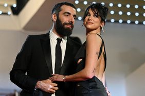 TOPSHOT - French director Romain Gavras (L) and British singer and model Dua Lipa arrive for the screening of the film "Omar la Fraise" (The King of Algiers) during the 76th edition of the Cannes Film Festival in Cannes, southern France, on May 20, 2023. (Photo by Patricia DE MELO MOREIRA / AFP) (Photo by PATRICIA DE MELO MOREIRA/AFP via Getty Images)