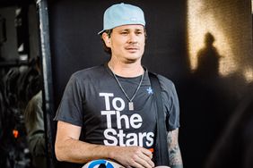 Tom DeLonge of Blink-182 poses backstage at the Sahara Tent during the 2023 Coachella Valley Music