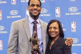 LeBron James of the Cleveland Cavaliers is joined by his mother Gloria James