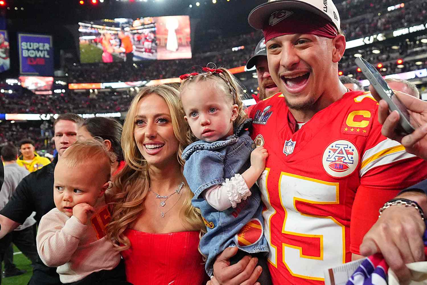Kansas City Chiefs Patrick Mahomes (15) poses with wife Brittany Mahomes and their children Patrick Bronze and Sterling Skye following victory vs San Francisco 49ers