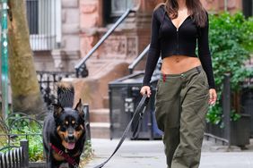 Emily Ratajkowski walks her dog on June 21, 2023 in New York City