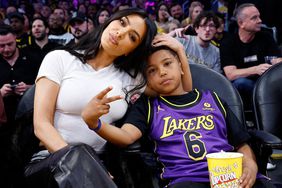 Kim Kardashian and Saint West attend a basketball game between the Los Angeles Lakers and Golden State Warriors at Crypto.com Arena on March 16, 2024 in Los Angeles, California.