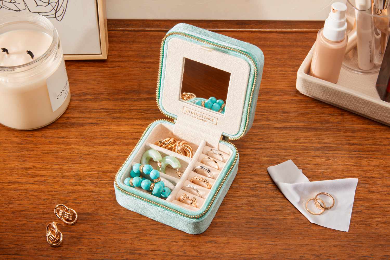 The Benevolence Plush Velvet Travel Jewelry Box Organizer filled with jewelry