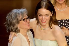 Sally Fieldpresents the Best Actress in a Leading Role award for "Poor Things" to Emma Stone onstage during the 96th Annual Academy Awards at Dolby Theatre on March 10, 2024 in Hollywood, California. 