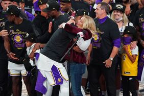 ORLANDO, FL - OCTOBER 11: Jeanie Buss and LeBron James #23 of the Los Angeles Lakers hug on court after winning Game Six of the NBA Finals against the Miami Heat on October 11, 2020 in Orlando, Florida at AdventHealth Arena. NOTE TO USER: User expressly acknowledges and agrees that, by downloading and/or using this Photograph, user is consenting to the terms and conditions of the Getty Images License Agreement. Mandatory Copyright Notice: Copyright 2020 NBAE (Photo by Jesse D. Garrabrant/NBAE via Getty Images)