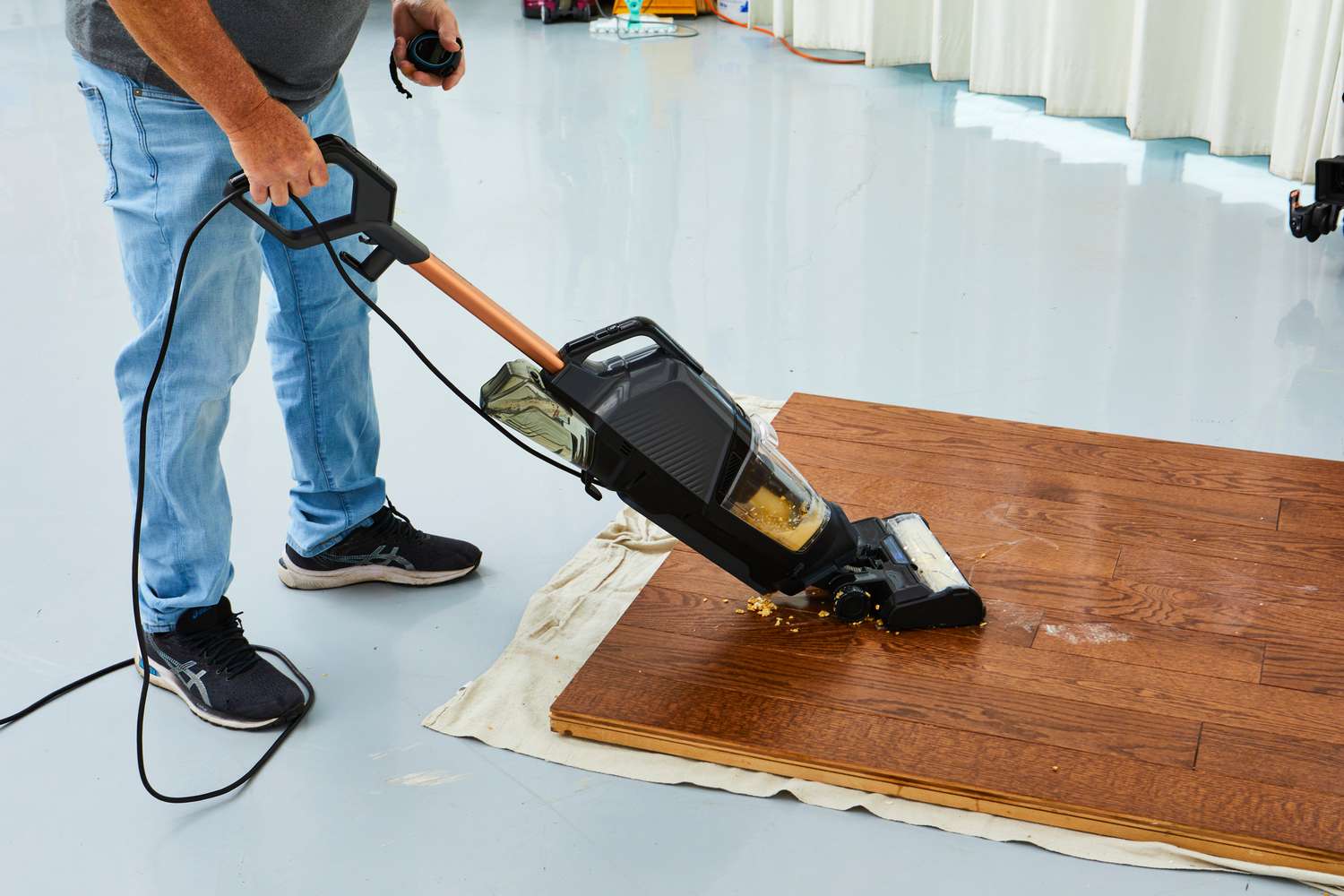 Person cleaning wood floor with the Bissell CrossWave HydroSteam Plus Multi-Surface Wet Dry Vac