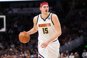 Nikola Jokic #15 of the Denver Nuggets dribbles against the Memphis Grizzlies at Ball Arena on April 7, 2022 in Denver, Colorado.