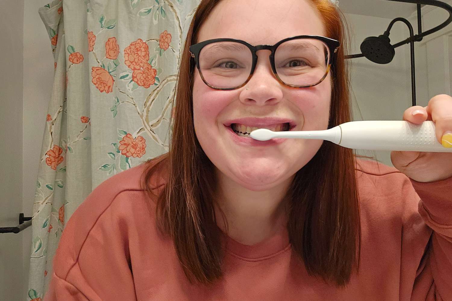 A person using a toothbrush to brush their teeth with Crest Gum Detoxify Deep Clean Toothpaste