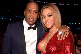 Jay Z (L) and Beyonce pose during The 59th GRAMMY Awards