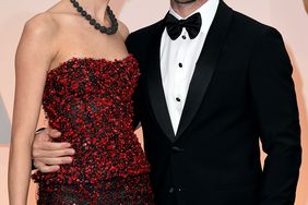 Adam Levine (R) and Behati Prinsloo attend the 87th Annual Academy Awards at Hollywood & Highland Center on February 22, 2015 in Hollywood, California