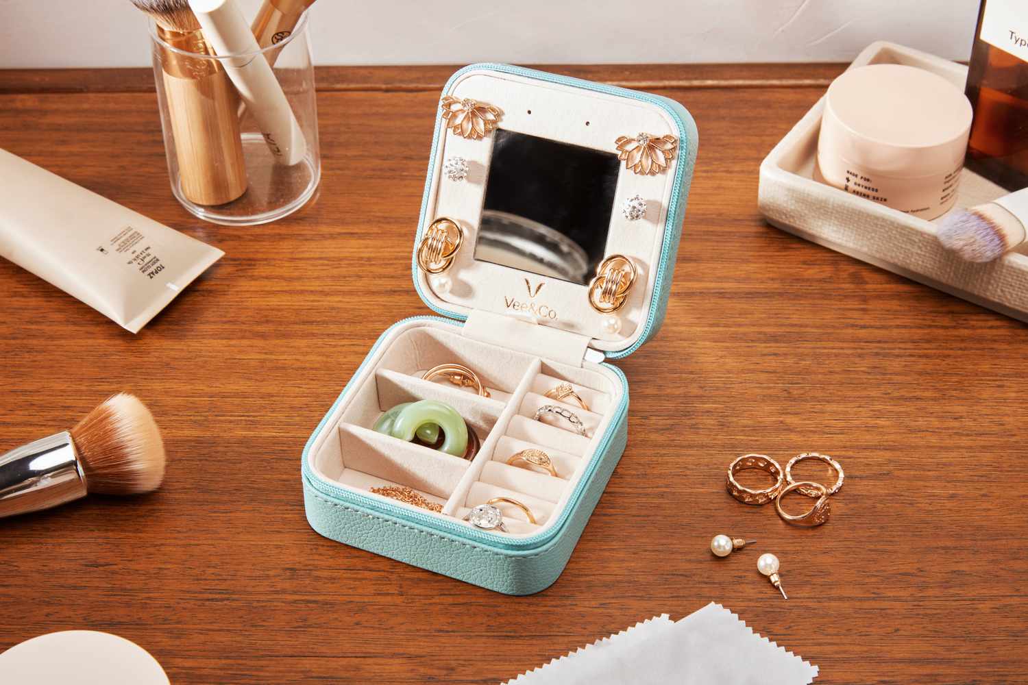 A Vee & Co. Small Travel Jewelry Case open on a counter