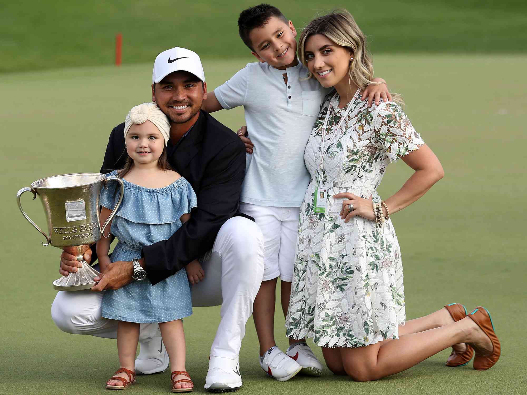 Jason Day and Ellie Day with their children, Dash and Lucy, on the 18th green after winning the 2018 Wells Fargo Championship on May 6, 2018 in Charlotte, North Carolina. 