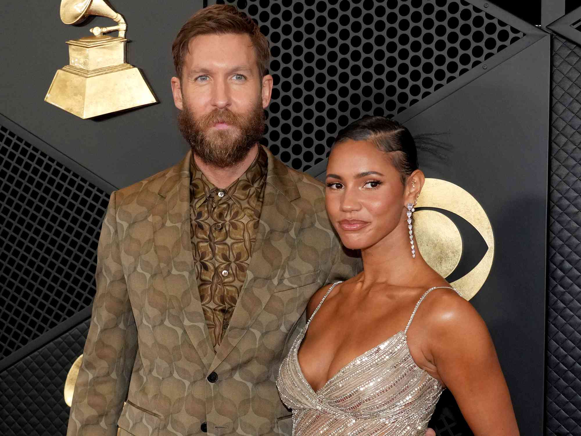 Calvin Harris and Vick Hope attend the 66th GRAMMY Awards on February 04, 2024 in Los Angeles, California. 