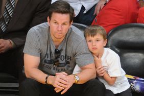 Mark Wahlberg (L) and his son Michael Wahlberg attend a basketball game between the Miami Heat and the Los Angeles Lakers