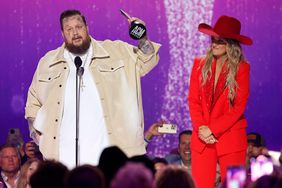 Jelly Roll and Lainey Wilson accept the Music Event of the Year award for "Save Me" onstage during the 59th Academy of Country Music Awards at The Ford Center at The Star on May 16, 2024 in Frisco, Texas. 