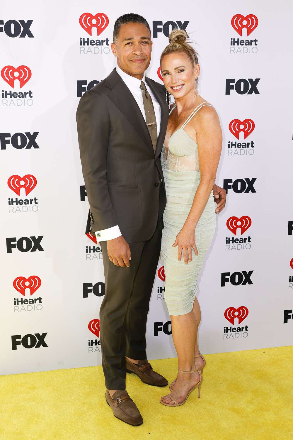 TJ Holmes and Amy Robach attend the 2024 iHeartRadio Music Awards at Dolby Theatre on April 01, 2024 in Hollywood, California