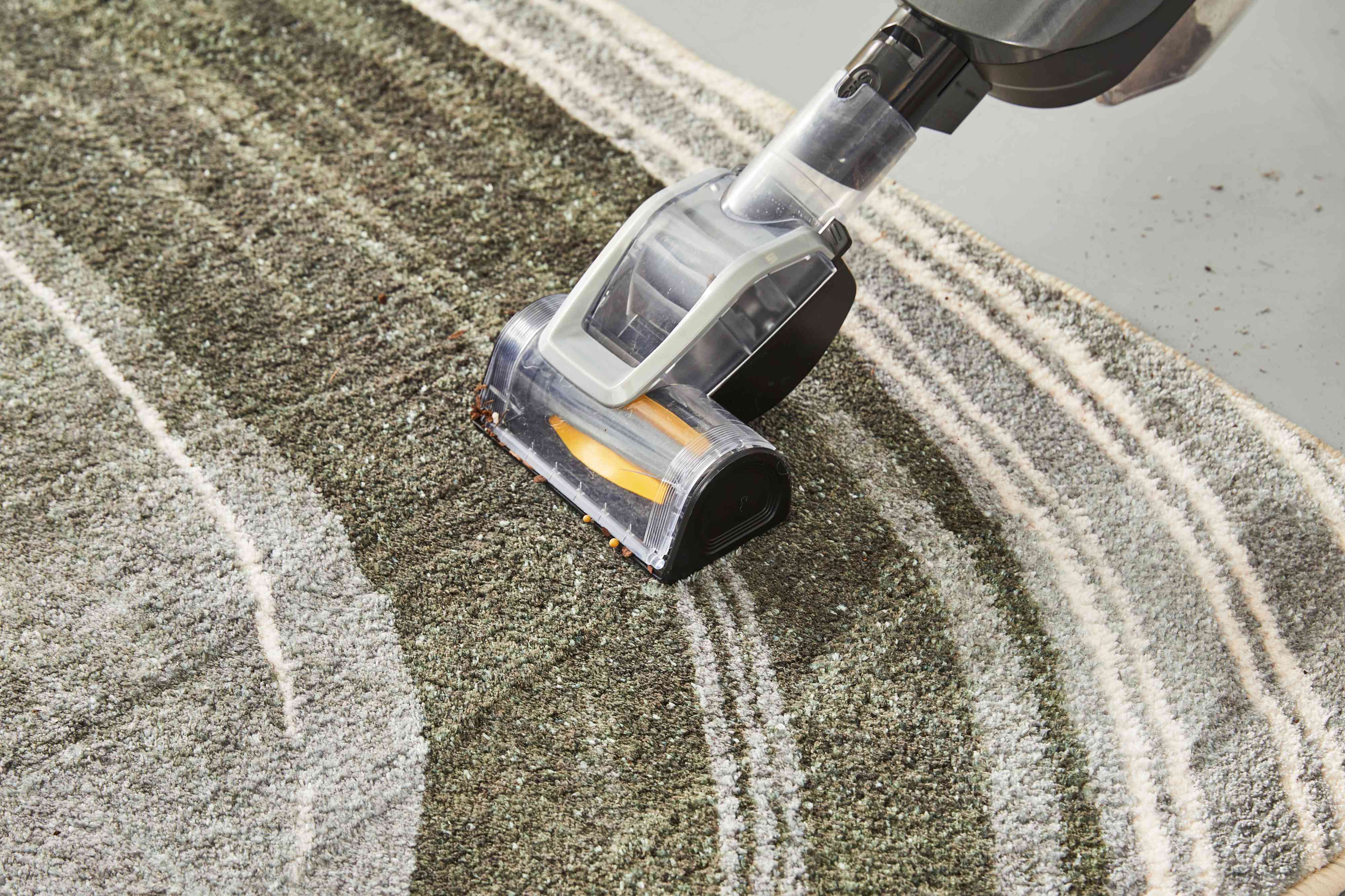 The West Elm Waterfall Washable Rug being vacuumed