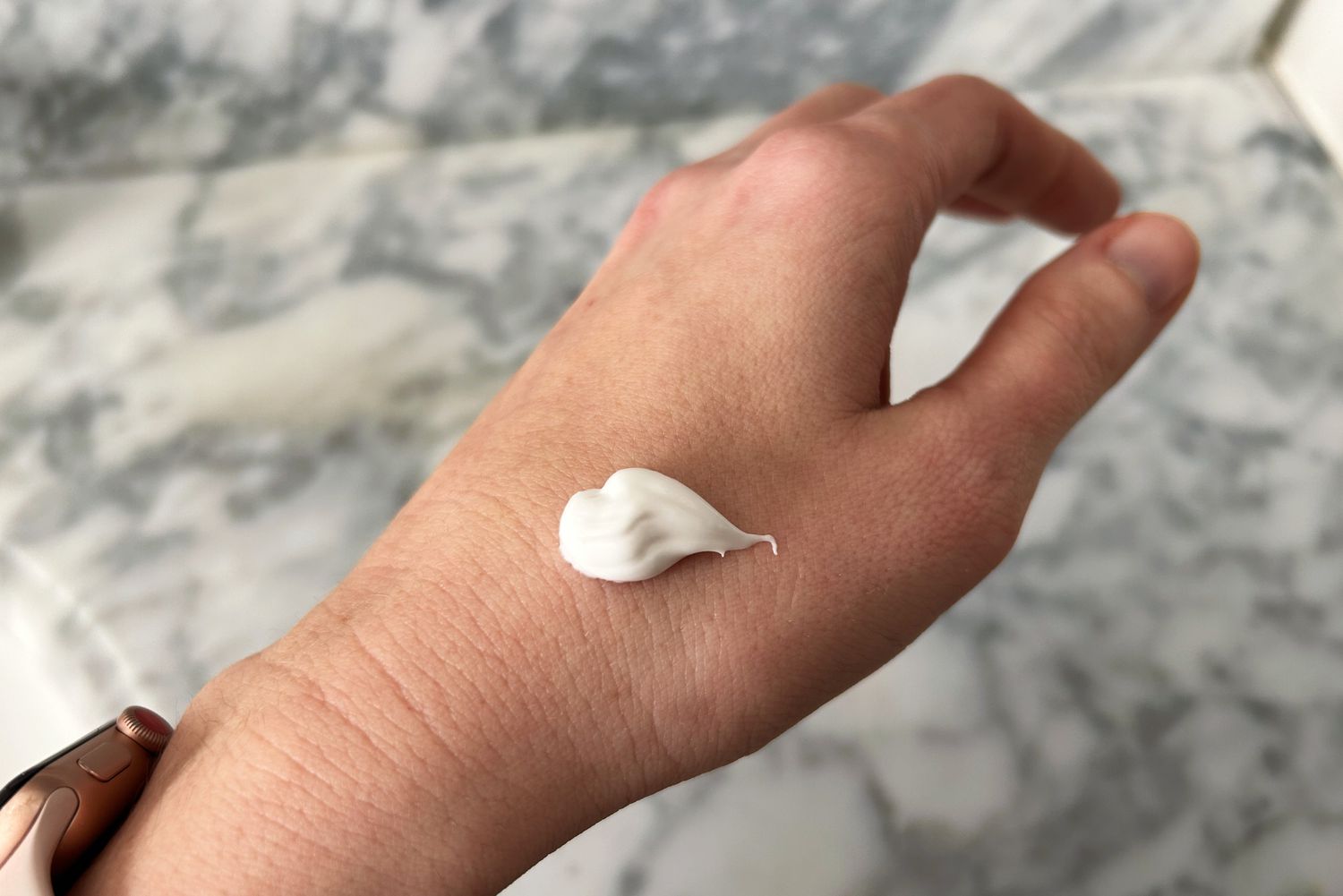 Closeup of a dab of Vanicream HC 1% Hydrocortisone Anti-Itch Cream on a person's hand
