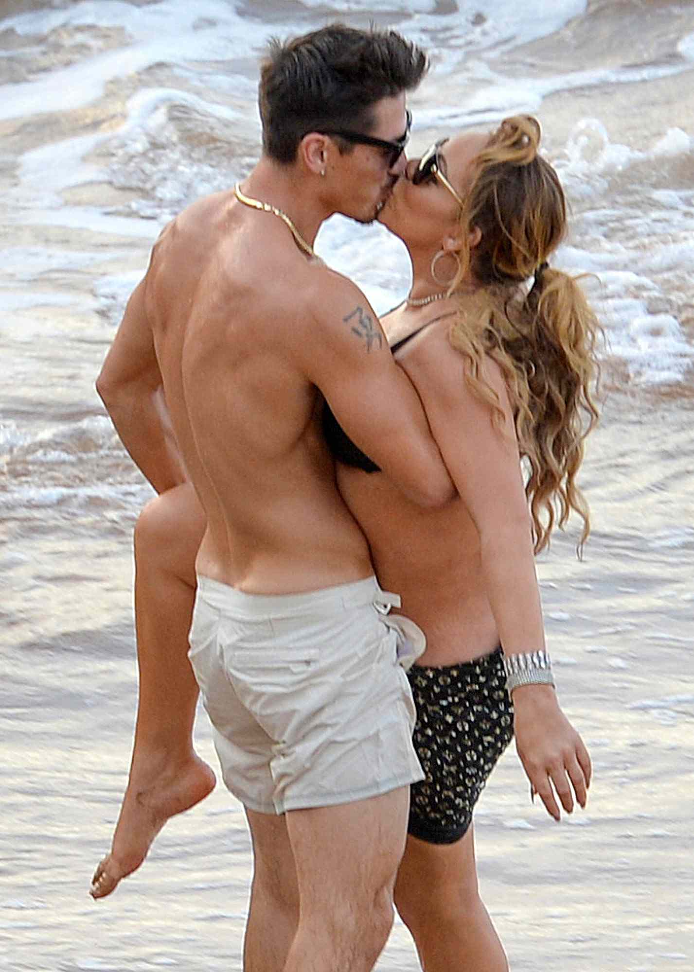 Mariah Carey and Bryan Tanaka Pack On The PDA Causing A Nip Slip In Hawaii