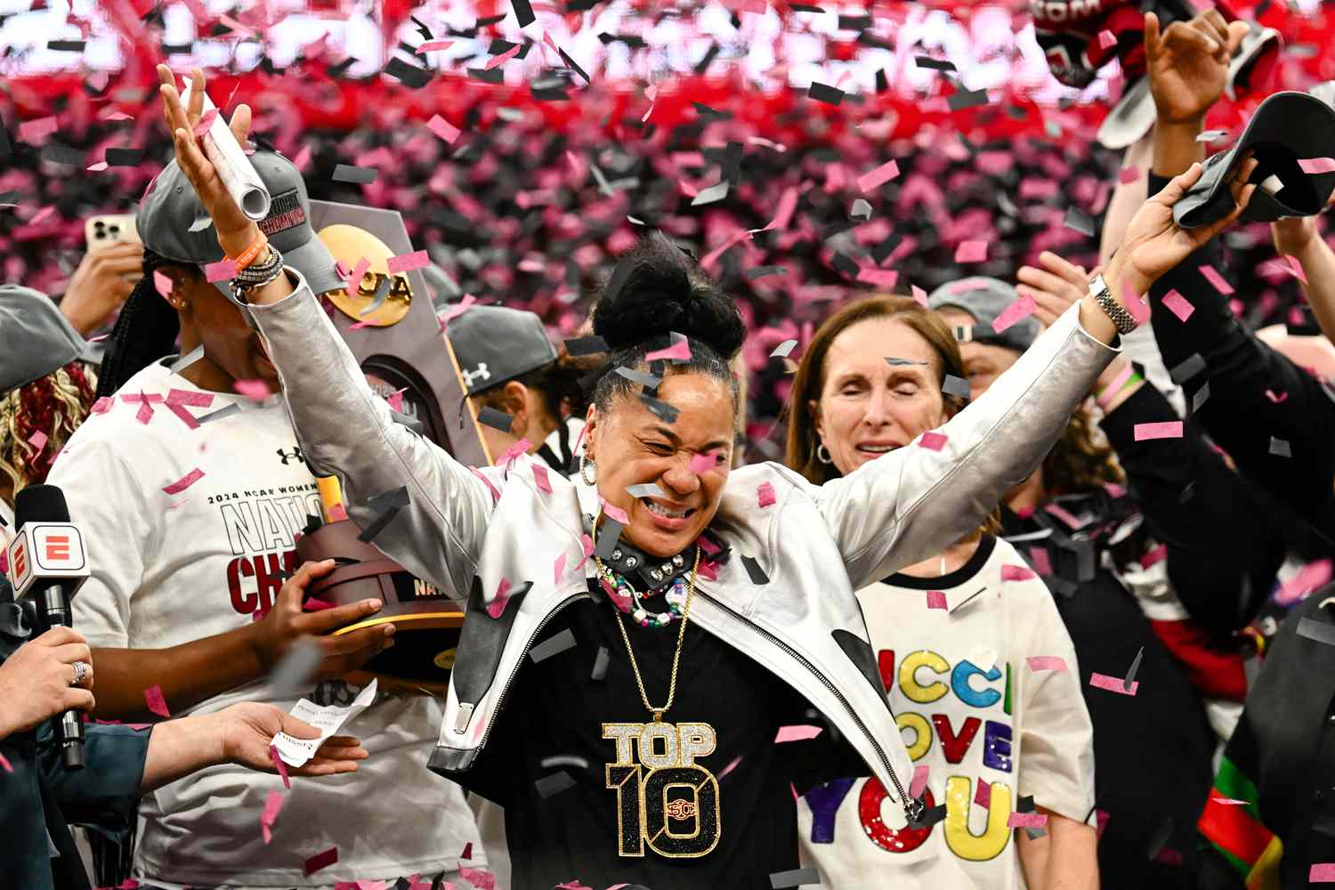 Head coach Dawn Staley of the South Carolina Gamecocks is showered with confetti after defeating the Iowa Hawkeyes 87-75 at the 2024 NCAA Women's Basketball Tournament championship game between Iowa and South Carolina at Rocket Mortgage FieldHouse on April 7, 2024 in Cleveland, Ohio. 