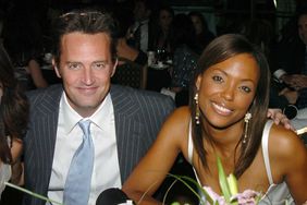 Pictured: (L-R) Matthew Perry and Aisha Tyler pose together in 2004